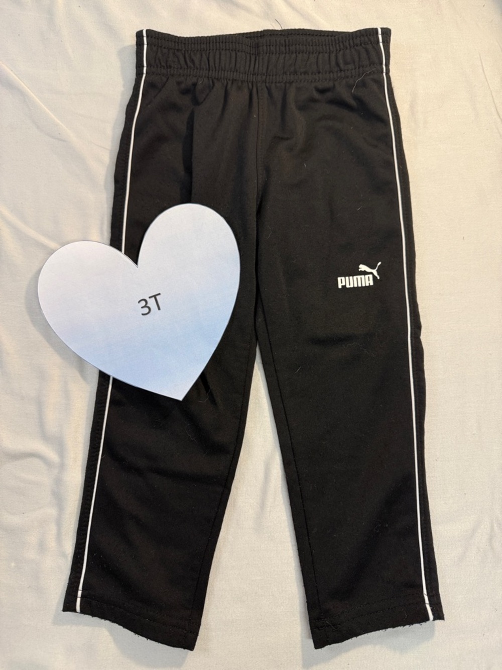 PUMA - Kids Black Joggers/Track pants with classic White stripes